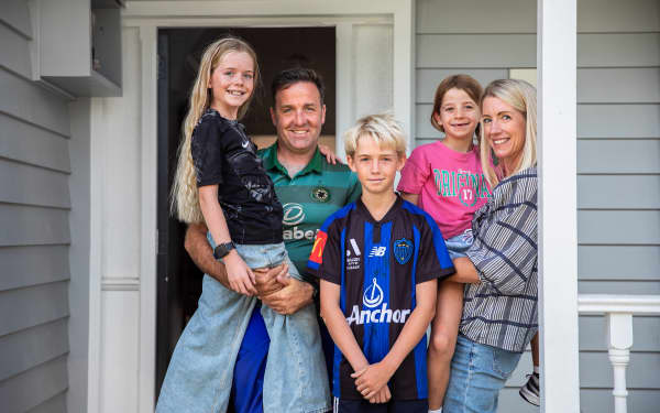 Eve, Jon, Brady, Charlotte and Juliet Dale (left to right) photographed on their front porch.