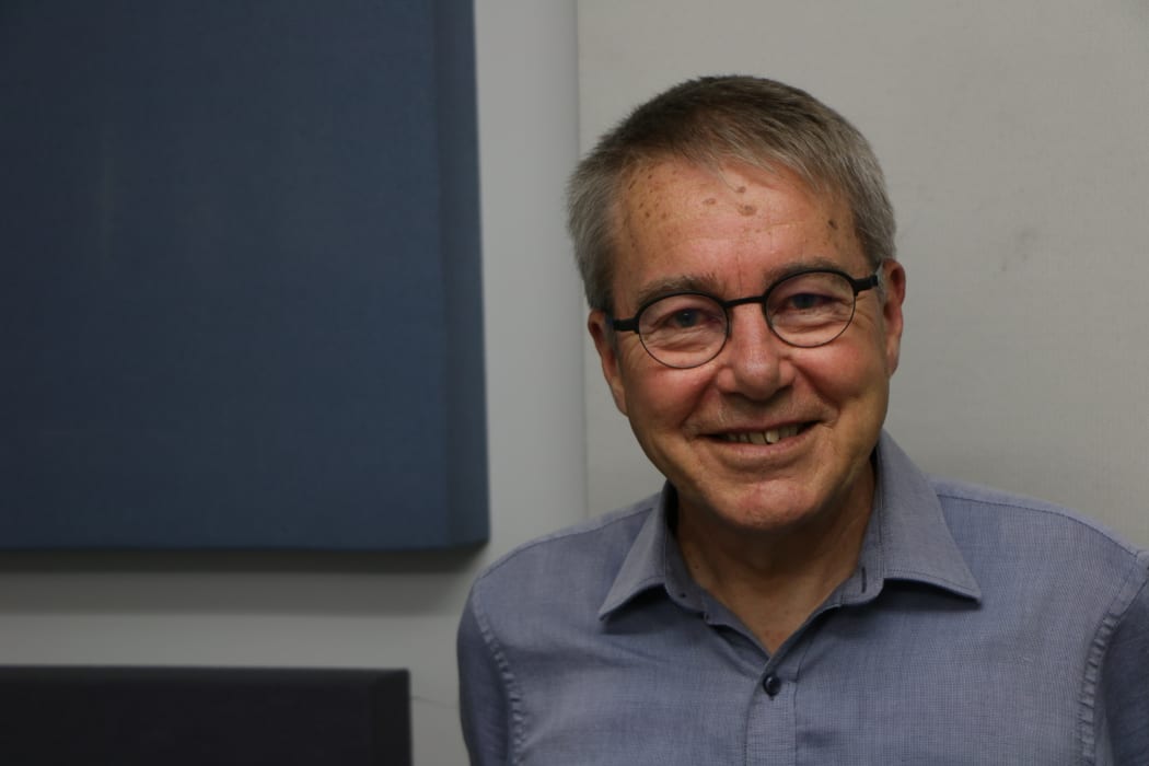 Head and shoulders photo of man in glasses