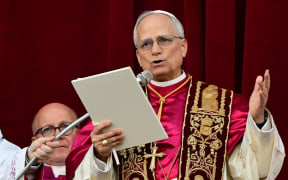 Newly elected Pope Leo XIV, Robert Prevost addresses the crowd on the main central loggia balcony of the St Peter's Basilica for the first time, after the cardinals ended the conclave, in The Vatican, on May 8, 2025. Robert Francis Prevost was on Thursday elected the first pope from the United States, the Vatican announced. A moderate who was close to Pope Francis and spent years as a missionary in Peru, he becomes the Catholic Church's 267th pontiff, taking the papal name Leo XIV. (Photo by Tiziana FABI / AFP)