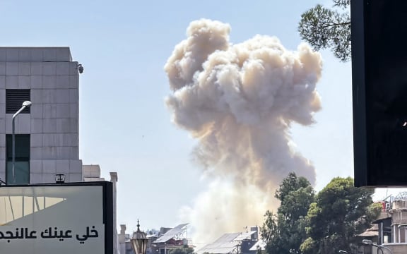 Smoke billows following Israeli strikes near the Syrian army and defence ministry headquarters in Damascus on 16 July, 2025.