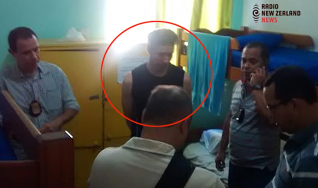 Phillip John Smith being taken into custody at the Maravilhosa Hostel in Rio de Janeiro, Brazil.