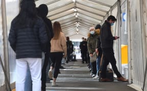 People queue for a Covid-19 test in Melbourne on May 27, 2021 after five million people in Melbourne were ordered into a snap week-long lockdown following another Covid-19 virus outbreak.
