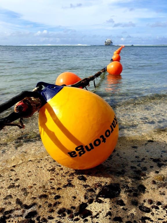 The first cable buoy reaching land in Rutaki, Rarotonga, Cook Islands.