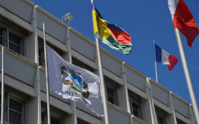 Flags outside the French High Commission in New Caledonia.