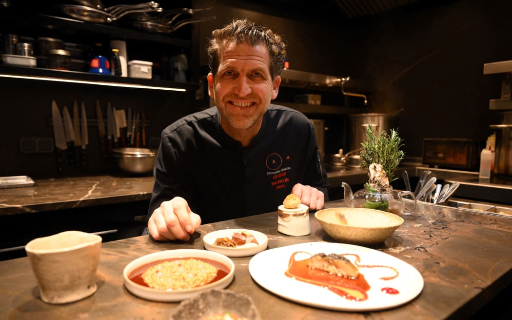 French chef Alexandre Mazzia poses at his three Michelin star restaurant AM in Marseille, southern France, on February 15, 2024. Alexandre Mazzia, a former pro basketball player born in the Republic of Congo, was chosen to be one of the three great chefs, who will feed the athletes during the Paris Olympics. (Photo by Nicolas TUCAT / AFP)