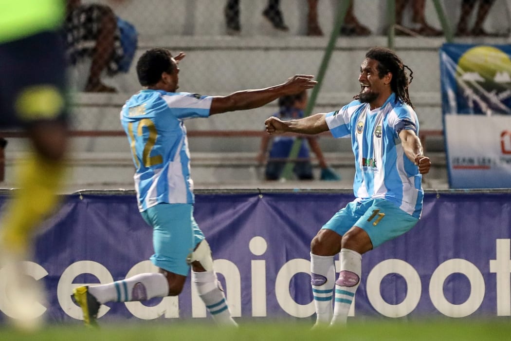 Amy Antoine Roine and captain Bertrand Kai celebrate the game's only goal.