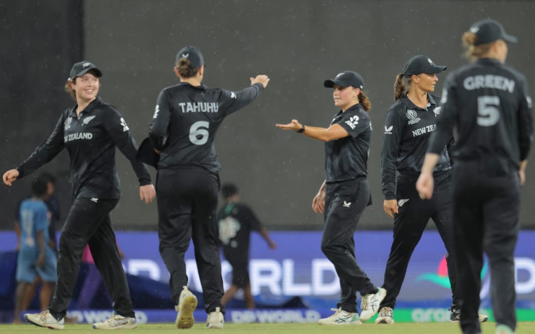 Players leaving the ground as rain stops play during the White Ferns match with Pakistan.