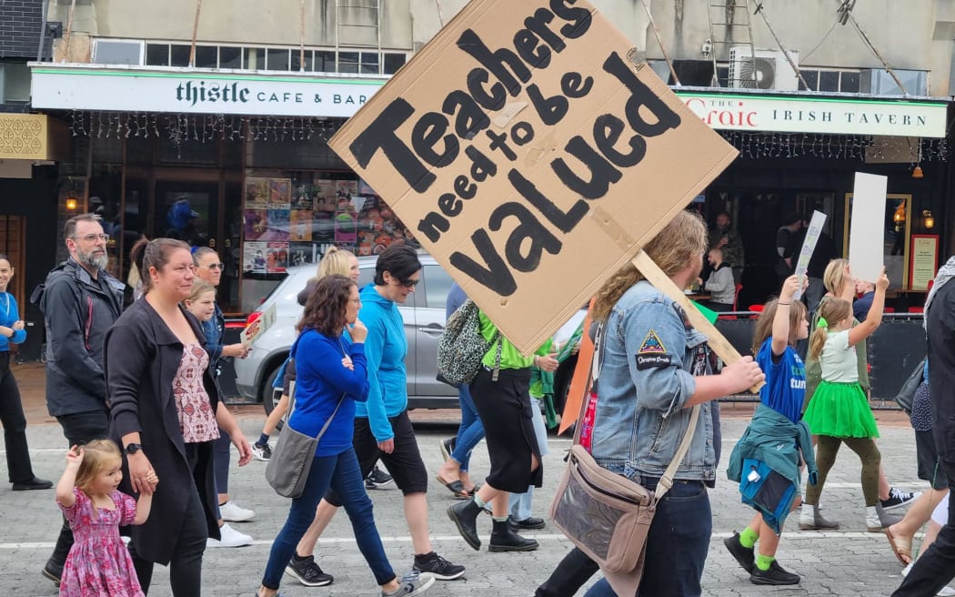 Teachers striking over pay and conditions march in Dunedin, 16 March 2023.