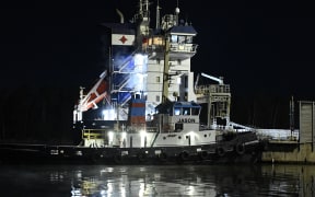 The Fitburg, a 132-meter-long cargo ship, is anchored in the harbour after being seized by Finnish authorities in Kirkkonummi on December 31, 2025. Finnish police said on December 31, 2025, they had seized a vessel suspected of damaging a telecommunications cable that runs between Helsinki and Tallinn in the Gulf of Finland several hours earlier. (Photo by Roni Rekomaa / Lehtikuva / AFP) / Finland OUT / FINLAND OUT / FINLAND OUT