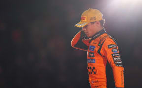 Second placed Lando Norris of Great Britain and McLaren (later disqualified) on the podium during the F1 Grand Prix of Las Vegas at Las Vegas Strip Circuit on November 22, 2025 in Las Vegas, Nevada.