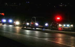 The motorcade for former US president Barack Obama quickly took him away, attended by police,after his flight landed in Auckland.