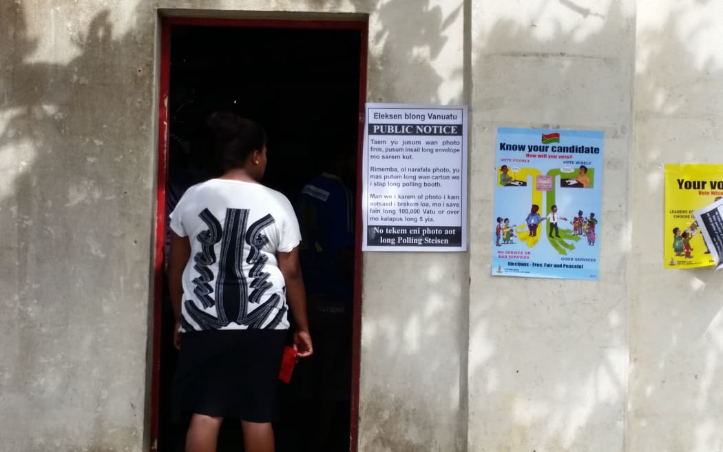 Voter waits to choose a candidate for the snap election in Port Vila.