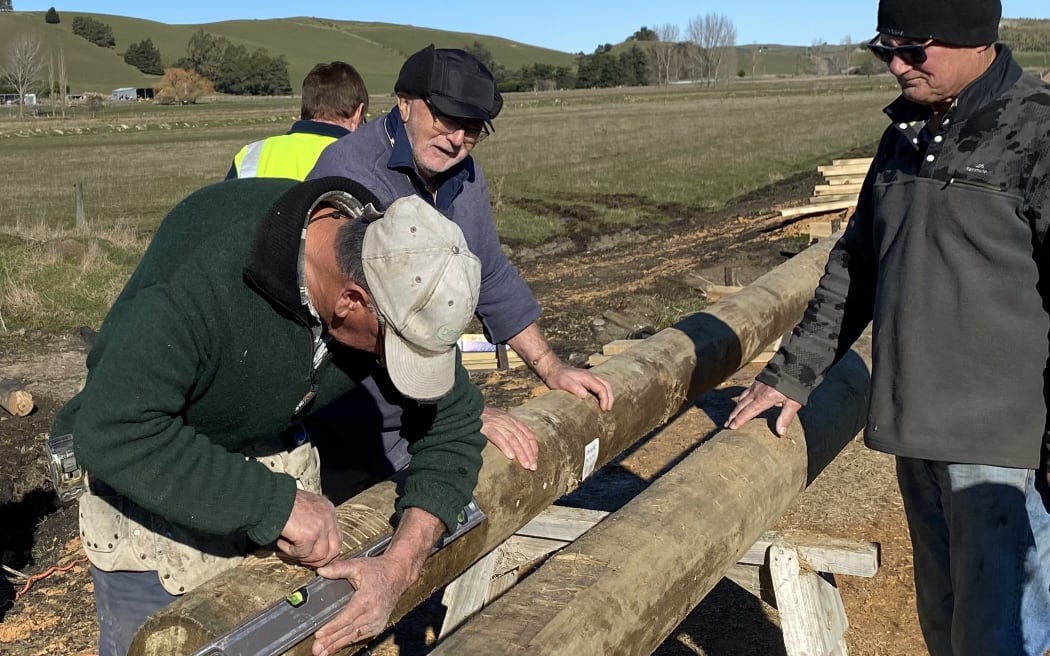 Members of the Waimate Lions Club at work on timber used for construction of the Waimate Trail