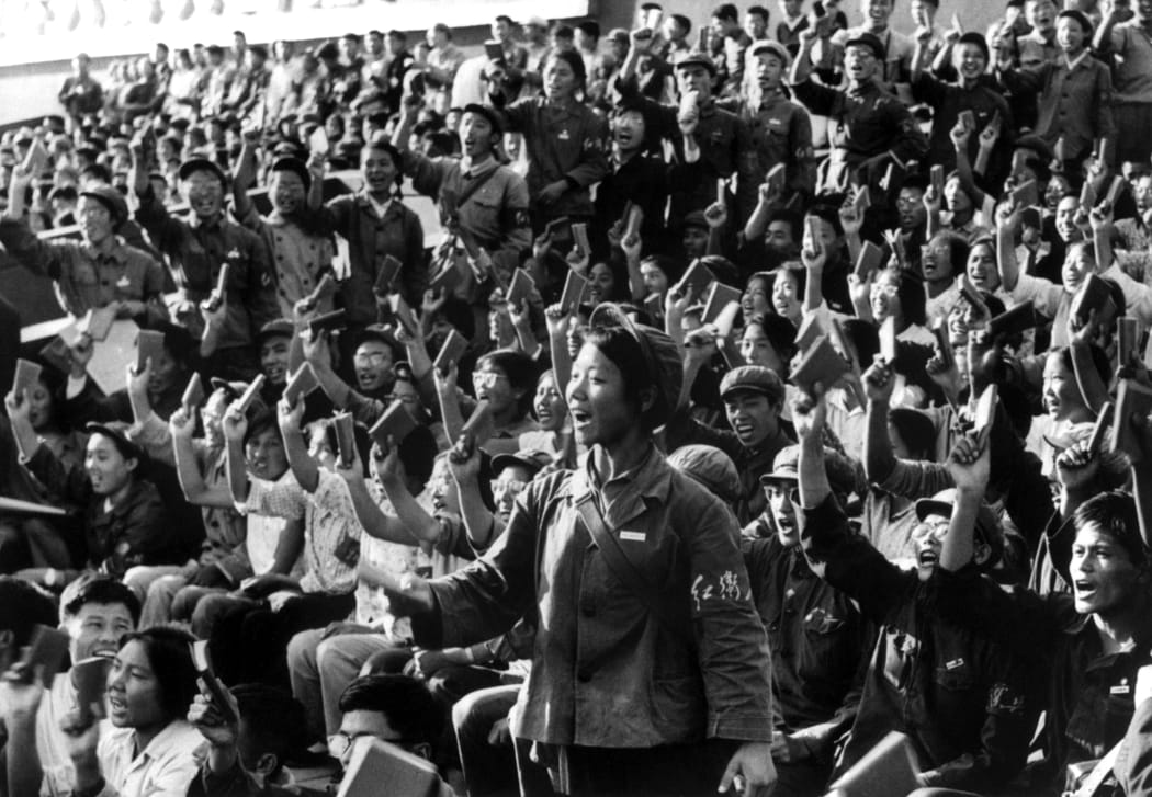 A squad of Red Guards, high school and university students, brandishing the copies of Chairman Mao Zedong's "Little Red Book," staging a rally in September 1966 in Beijing's street to spread Mao's thought during the Great Proletarian Cultural Revolution.