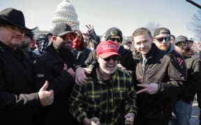 WASHINGTON, DC - FEBRUARY 21: (L-R) Stewart Rhodes, Enrique Tarrio, Joe Biggs and Zach Rehl, members of the far-right group the Proud Boys, rally outside the U.S. Capitol following a news conference on February 21, 2025 in Washington, DC. The news conference was held in the same area where thousands of supporters of President Donald Trump attacked the U.S. Capitol on January 06, 2021 in an attempt to halt the certification of former President Joe Biden's election victory. In one of the first acts of his second term, Trump pardoned nearly 1,600 people charged and convicted of crimes related to the assault.   Chip Somodevilla/Getty Images/AFP (Photo by CHIP SOMODEVILLA / GETTY IMAGES NORTH AMERICA / Getty Images via AFP)