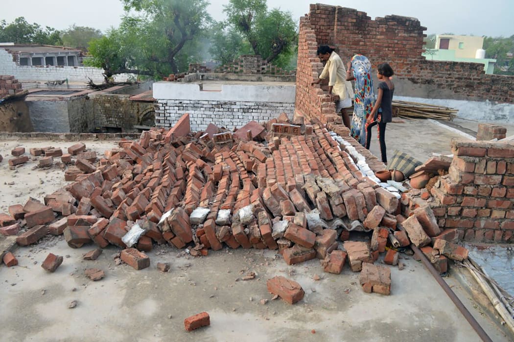 Dust storms tore across northern India killing at least 77 people and injuring 143 as trees and walls were flattened by powerful winds, officials said May 3.