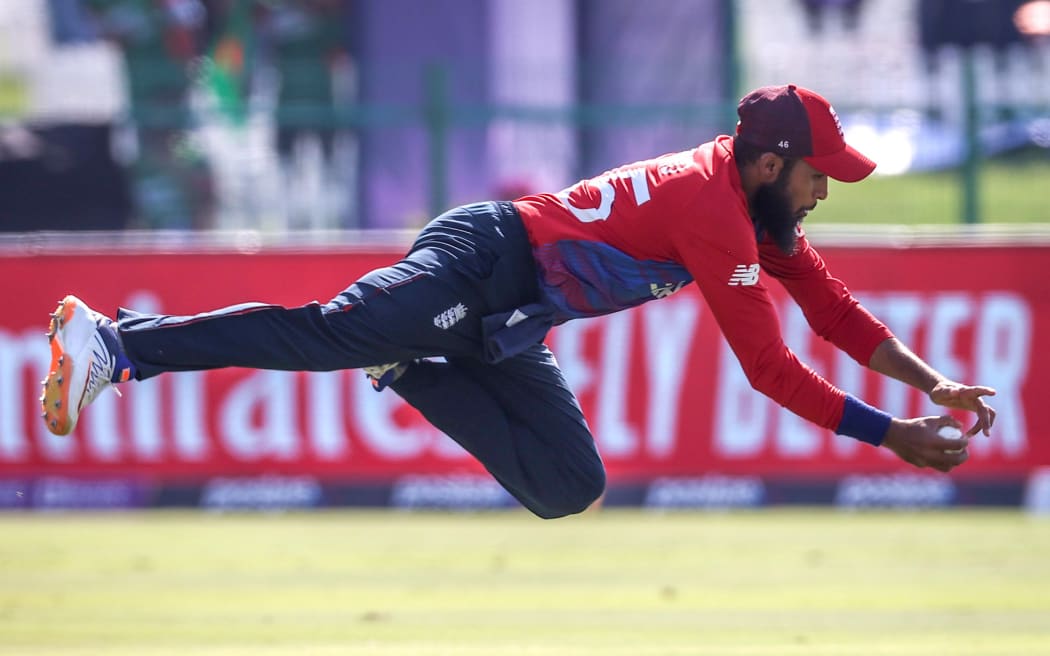 England's Adil Rashid dives to take a catch in England's win over Bangladesh. T20 World Cup match in Abu Dhabi 2021. Copyright photo: David Gray / www.photosport.nz