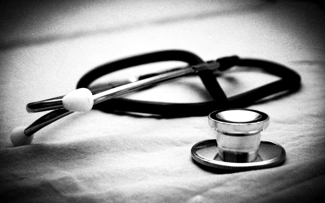 dark vignette and black and white  stethoscope.