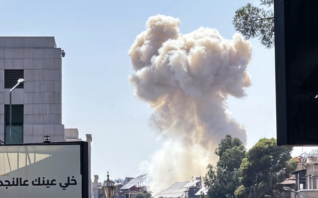 Smoke billows following Israeli strikes near the Syrian army and defence ministry headquarters in Damascus on 16 July, 2025.