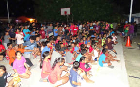 Marshall Islands residents have seen their pocketbooks hard hit by skyrocketing prices across the board, with fuel hitting $7 per gallon this past week for the first time ever. Pictured: A crowd of young people at a sports event in downtown Majuro in November 2021.