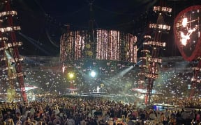 A large crowd watches Ed Sheeran in Wellington.