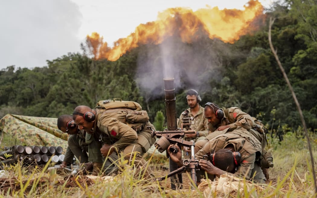 A mortar detachment puts theory into practice at the Nausori Highlands Training Area during Exercise Cartwheel