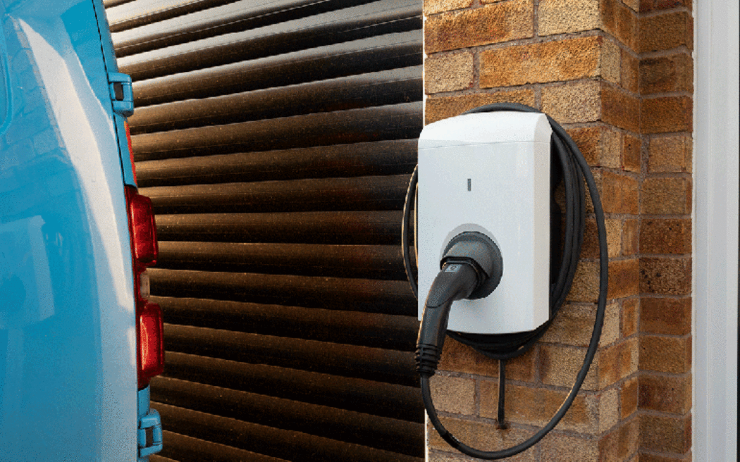 An example of a smart charger for an electric vehicle, mounted on a wall.