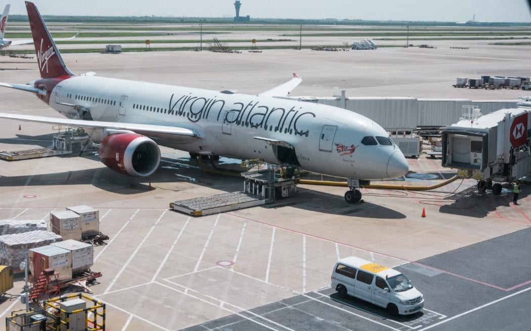 general view of an aircraft of Virgin altlantic airline is seen parked at Pudong international airport in Shanghai, China on August 21, 2023 (Photo by Ying Tang/NurPhoto) (Photo by Ying Tang / NurPhoto / NurPhoto via AFP)