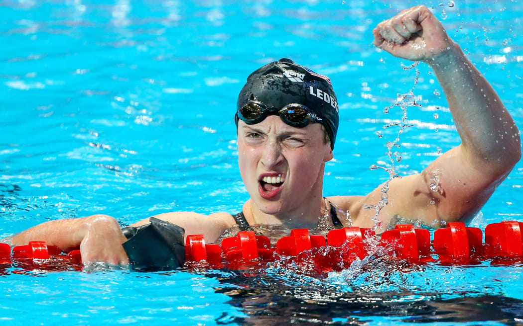 Katie Ledecky celebrates gold and a world record in the Women's 1500m freestyle final, Russia, 2015.
