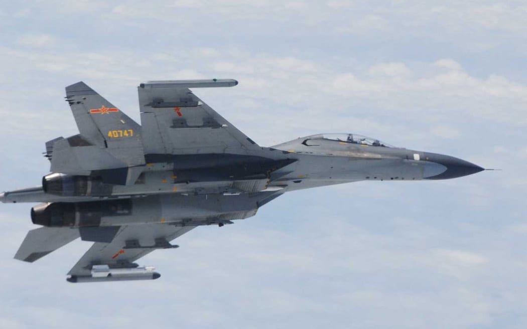 A Chinese Su-27 fighter jet that flew "dangerously" close to two Japanese military planes over the East China Sea