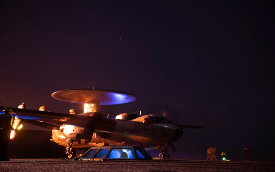 In this photo released by the US military's Central Command on January 22, 2024, US Central Command forces alongside UK Armed Forces, and with the support from Australia, Bahrain, Canada, and the Netherlands, conduct strikes on 8 Houthi targets in Iranian-backed Houthi terrorist-controlled areas of Yemen. The United States and Britain launched new strikes on Yemen's Huthis January 22, saying their second round of joint military action against the Iran-backed rebels was in response to continued attacks on shipping.
American and British forces carried out a first wave of strikes against the rebel group on January 11, and the United States launched further air raids against missiles that Washington said were ready to launch and posed a threat to both civilian and military vessels. (Photo by Handout / US Central Command (CENTCOM) / AFP) / RESTRICTED TO EDITORIAL USE - MANDATORY CREDIT "AFP PHOTO /  HANDOUT / CENTCOM " - NO MARKETING - NO ADVERTISING CAMPAIGNS - DISTRIBUTED AS A SERVICE TO CLIENTS
