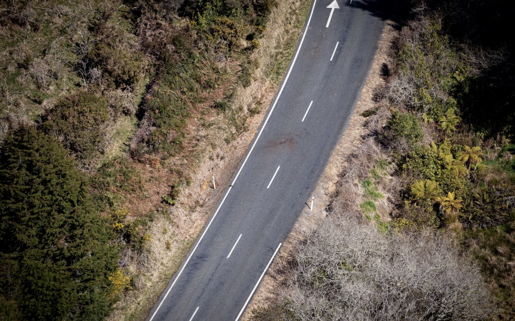 WAITOMO, NEW ZEALAND - SEPTEMBER 11: Marks on the road at the location where Tom Phillips died in a shoot out with police on Te Anga Road near Waitomo. Tom Phillips and his children had been hiding for the last four years. 11 September 2025. (Photo by Dean Purcell/New Zealand Herald via Getty Images)