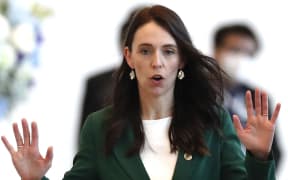 New Zealand's Prime Minister Jacinda Ardern gestures following the 29th APEC Economic Leaders’ Meeting (AELM) during the Asia-Pacific Economic Cooperation (APEC) summit in Bangkok on November 18, 2022. (Photo by Rungroj YONGRIT / POOL / AFP)