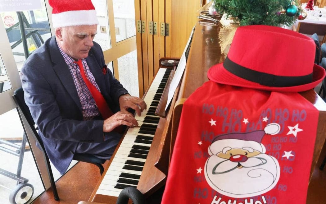 Tom Kelly serenaded guests on the piano at the shared Christmas lunch at St Peter’s Anglican Cathedral.