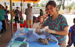 Wilderness Vet Caroline Murray spaying a cat in Cambodia.
