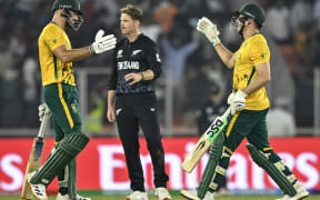 South Africa's captain Aiden Markram (L) and David Miller (R) celebrate their win over New Zealand at the T20 World Cup.