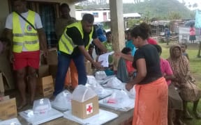 The Fiji Red Cross distributing relief items in Nakodu Village, Koro Island.