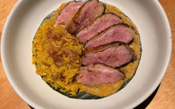 A dish of slices of panfried duck breast.