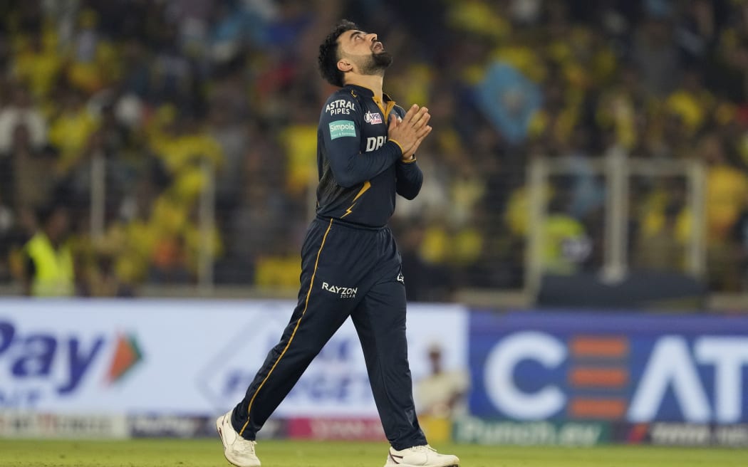 Gujarat Titans' Rashid Khan celebrates the wicket of Chennai Super Kings' Ravindra Jadeja during the Indian Premier League cricket match between Chennai Super Kings and Gujarat Titans in Ahmedabad, India, Friday, May 10, 2024. (AP Photo /Ajit Solanki)