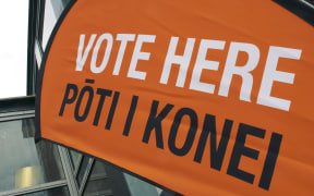 A orange flag says 'vote here'.