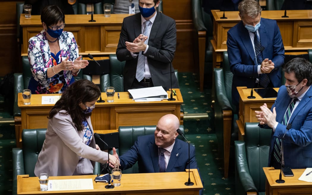 Christopher Luxon is applauded by his team and congratulated by his deputy Nicola Willis after his adjournment debate speech