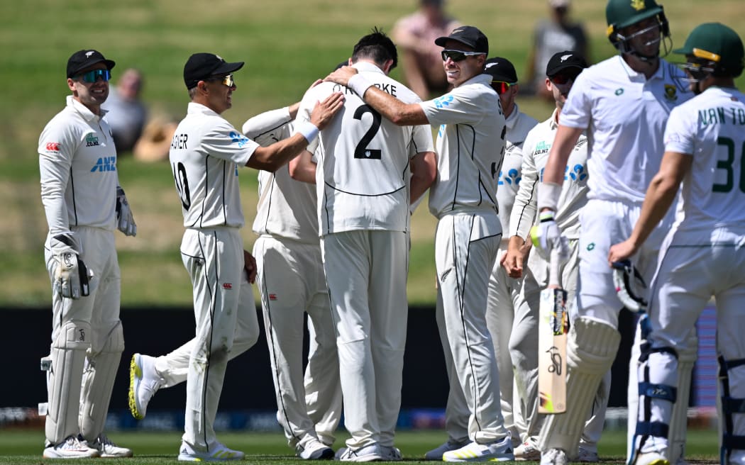 The Black Caps celebrate Will O'Rourke's first test wicket.