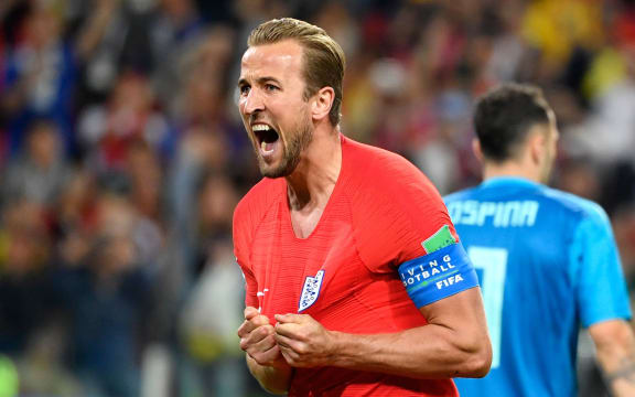 England's forward Harry Kane celebrates after scoring the opening goal from the penalty spot.