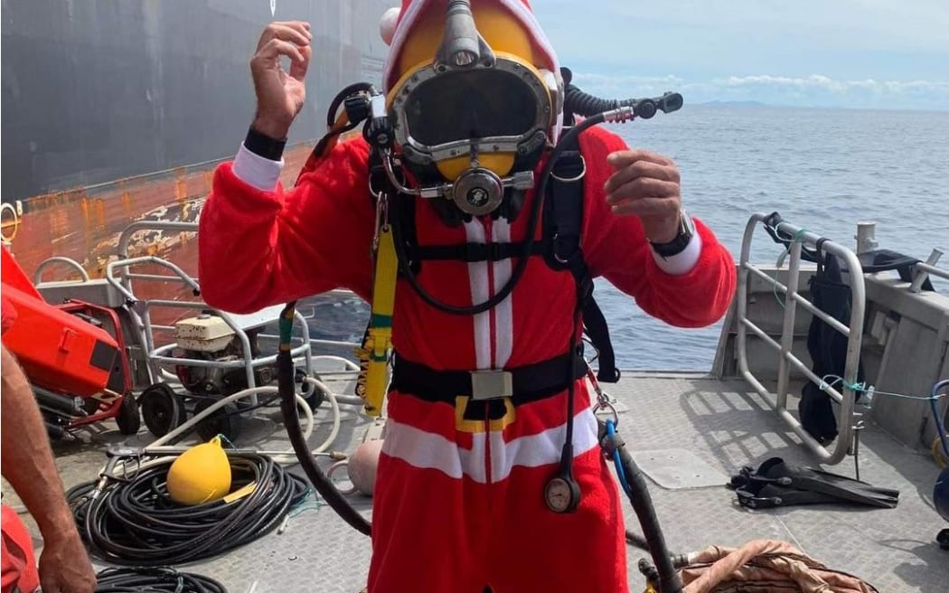 Bay Underwater Services diver having a little Christmas cheer while out at sea cleaning ships on Christmas Day 2022.