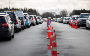 Cars line up as people wait to be tested for Covid-19 at the Orchard Road drive-through testing centre in Christchurch