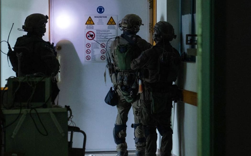 This handout picture released by the Israeli army on November 15, 2023, reportedly shows Israeli soldiers carrying out operations inside Al-Shifa hospital in Gaza City, amid continuing battles betweeen Israel and the Palestinian militant group Hamas. (Photo by Israeli Army / AFP) / RESTRICTED TO EDITORIAL USE - MANDATORY CREDIT "AFP PHOTO / ISRAELI ARMY " - NO MARKETING NO ADVERTISING CAMPAIGNS - DISTRIBUTED AS A SERVICE TO CLIENTS