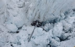 High resolution image of the wreckage of a helicopter on the Fox Glacier in 2015.