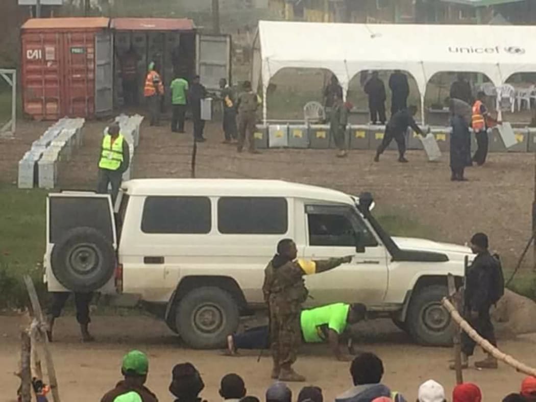 Papua New Guinea election polling officers being made to do push-ups by security forces in Banz, Jiwaka province.
