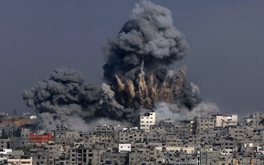 Heavy smoke billows from buildings following an Israeli military strike in Gaza City on Tuesday.