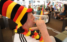 German football fans relax in a bar
